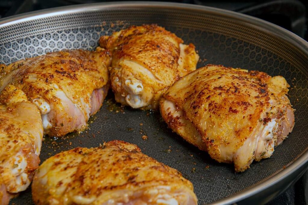 Flip the chicken and sear the other side. 
