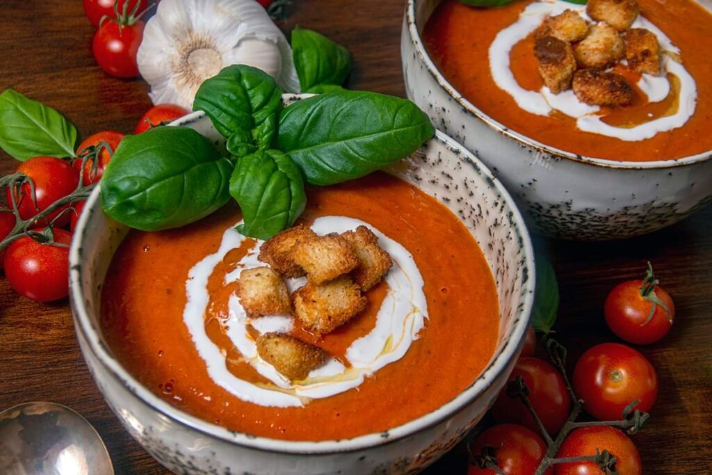 Finshed tomato basil soup in a bowl. Gluten free and vegan.